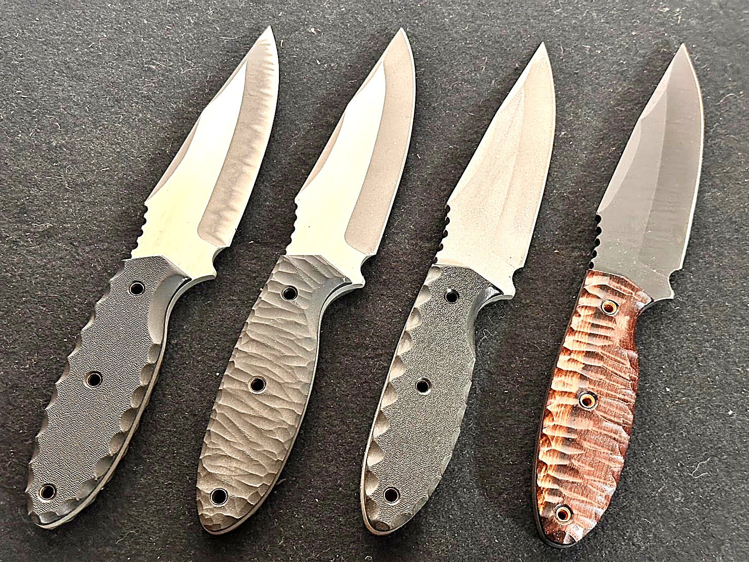 Complete Mononofu handmade knife lineup — Micarta, olive wood, paracord, and sculpted wood handles